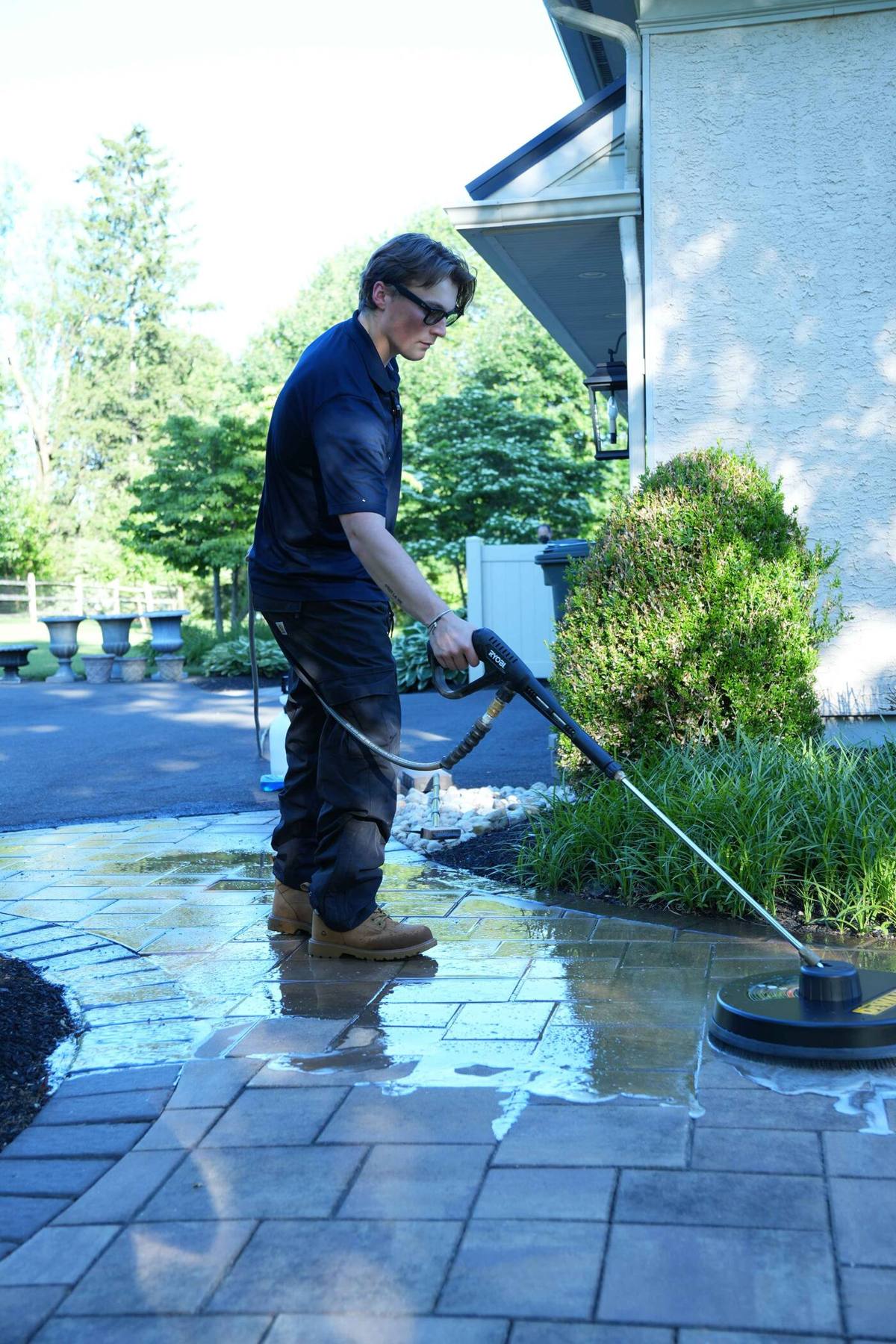 Petra Power Solutions' owner soft-washing a paver patio in Bucks County, PA